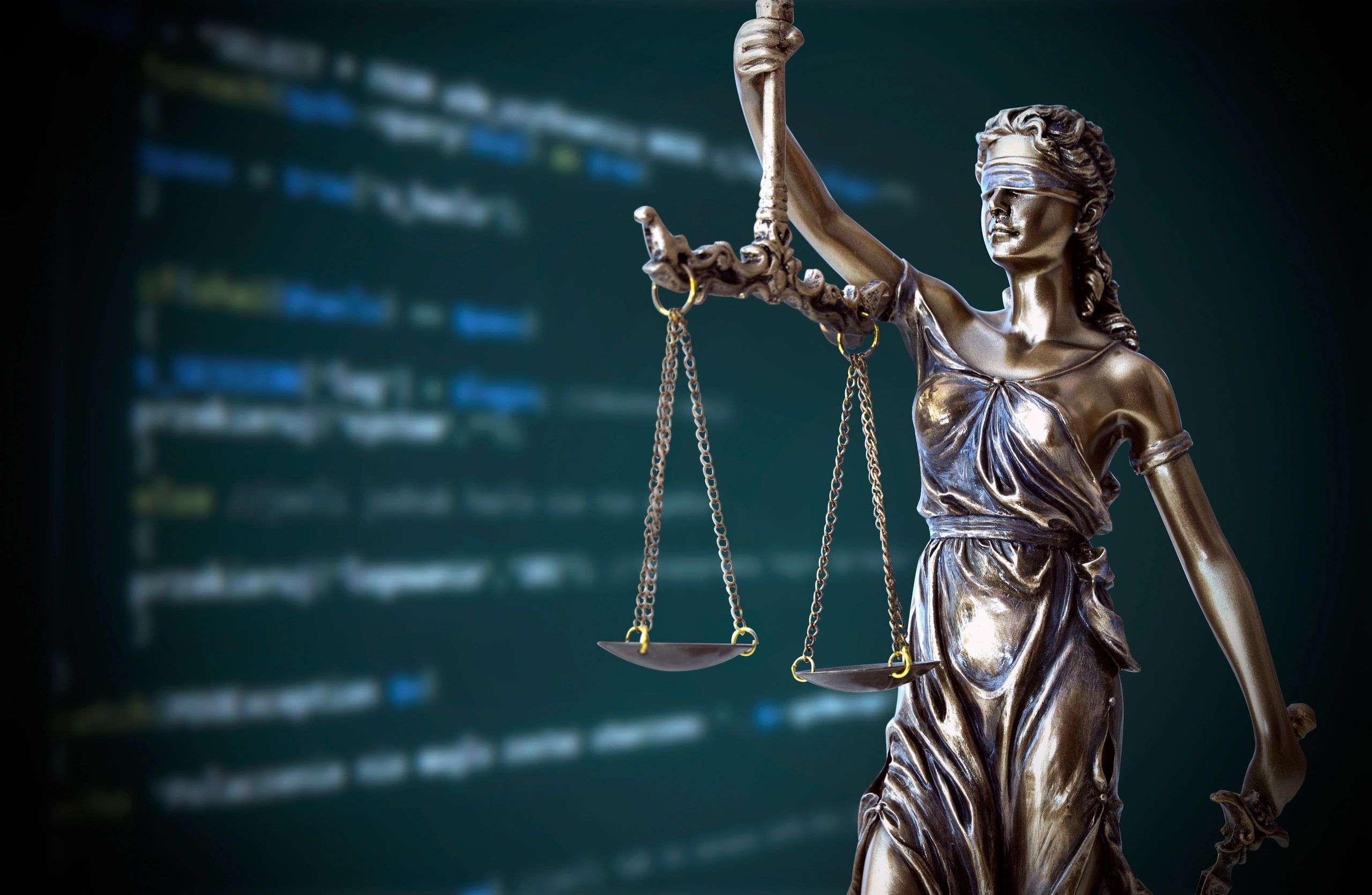 Lady Justice statue over a blue digital background, representing California estate planning and busi