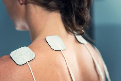 Electrical Stimulation performed to the upper traps for muscle tension and pain relief. 
