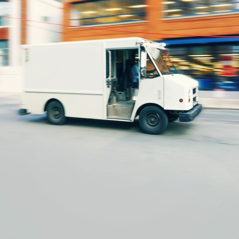 White delivery truck speeding - motion blur