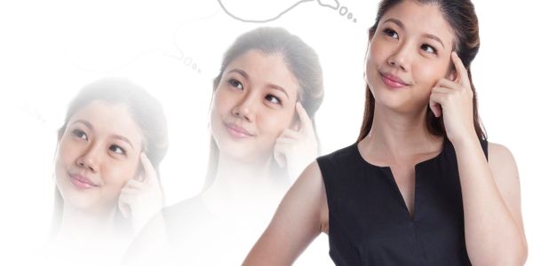 Woman having a bright idea, depicted with a glowing light bulb.