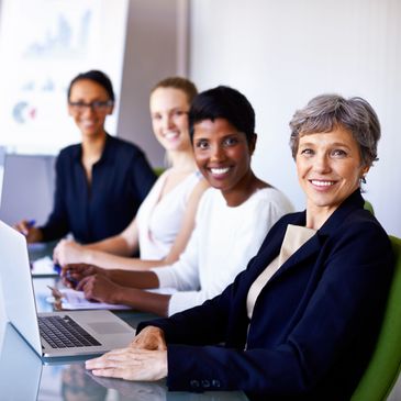 A group of empowered women at a menopause workplace workshop