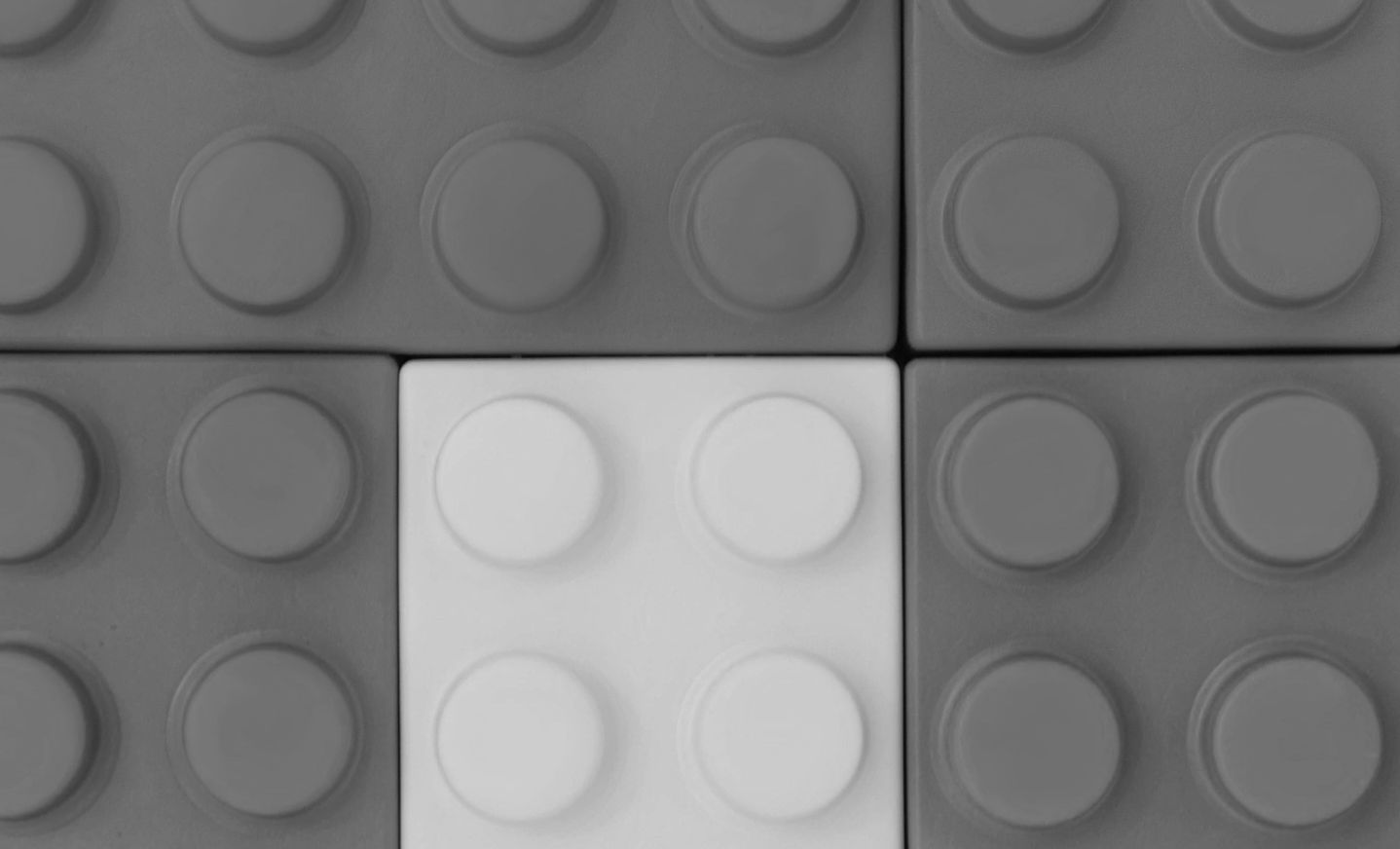 Colorful interlocking plastic building blocks arranged in a pattern.