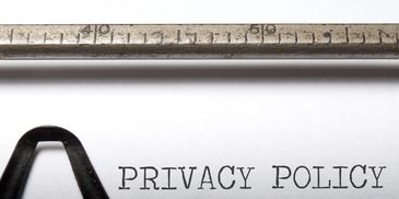 Close-up of a typewriter typing 'PRIVACY POLICY'.