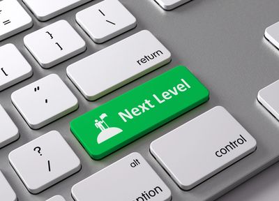 Keyboard with a green "Next Level" key replacing the Enter key.