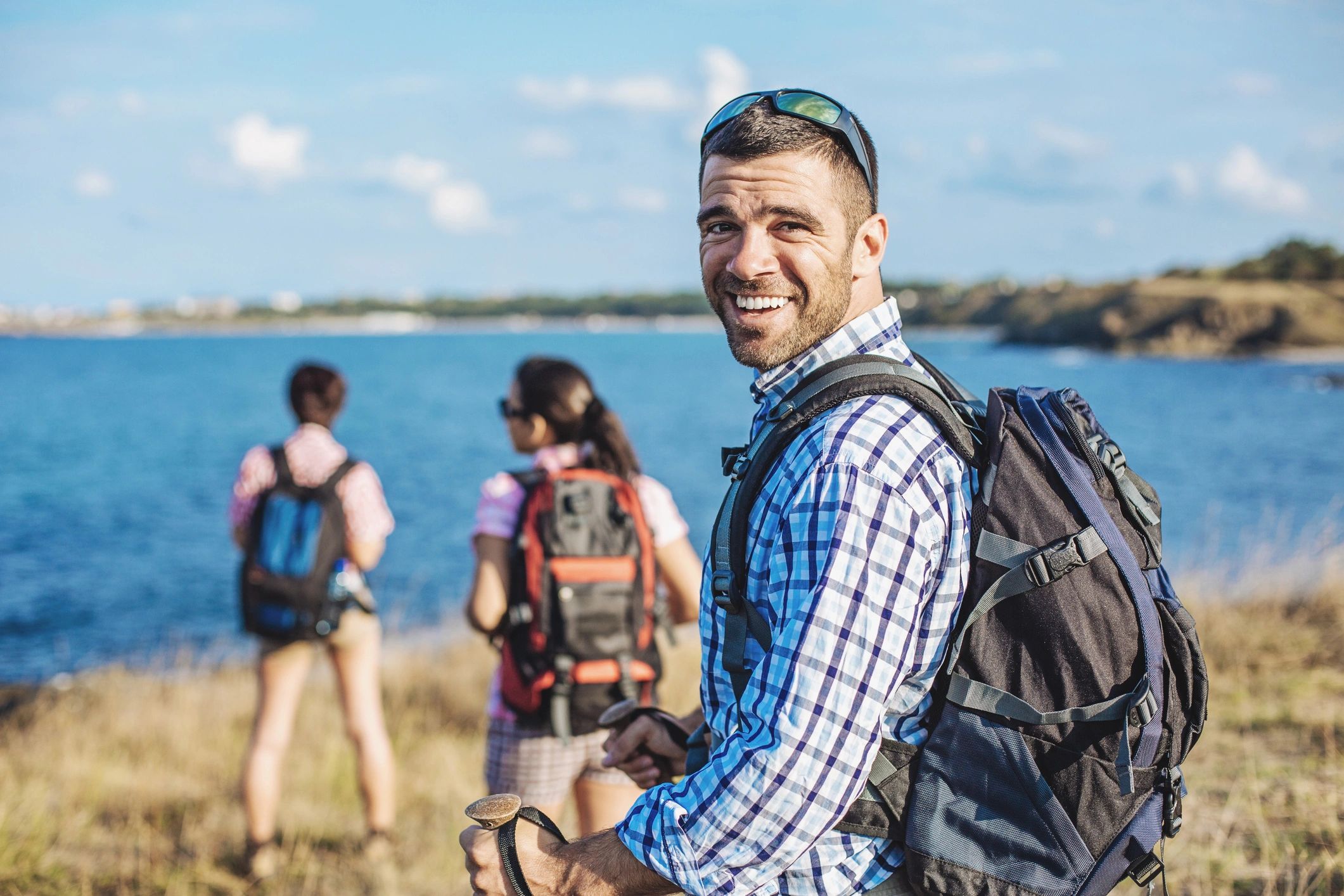 Man with leather backpack.