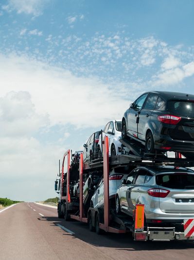 Vehicles being transported on a truck
