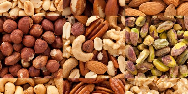 A collage of various nuts including peanuts, almonds, cashews, pecans, pistachios, and walnuts.