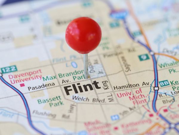 Red pin marking Flint on a detailed city map.