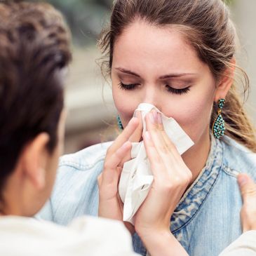 A patient experiencing respiratory symptoms representing chronic allergic rhinitis triggers