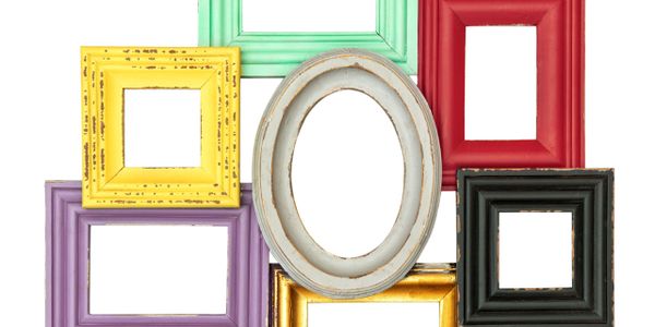 Various colorful empty picture frames arranged together on a white background.