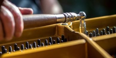 Close-up of piano tuning being performed.