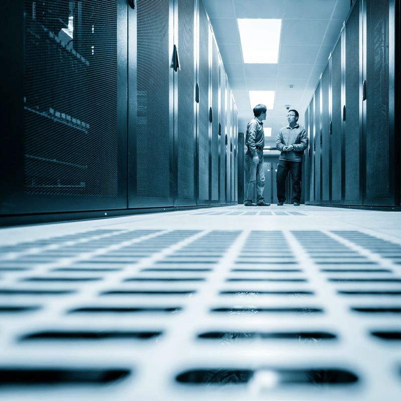 Administrators working on a server room