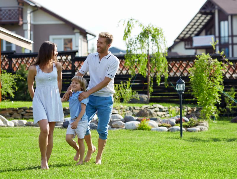 Families with a child on a lawn
