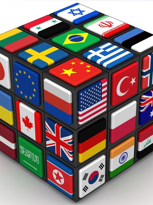A Rubik's cube featuring various international flags on its squares.