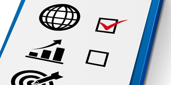Checklist with icons of globe, growth chart, and target, with a red checkmark on the globe.