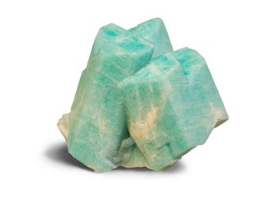 Close-up of a blue-green amazonite crystal cluster on white background.