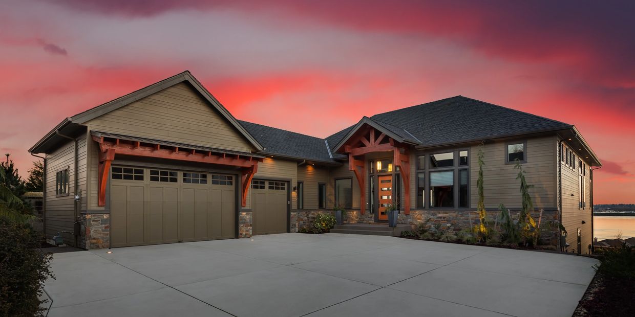 Modern house with wooden accents at sunset.
