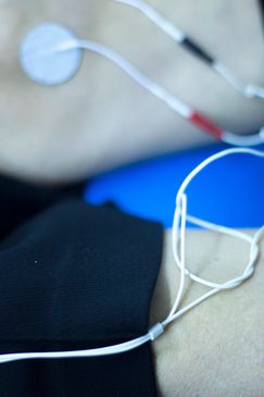 Electrodes attached to skin for monitoring.