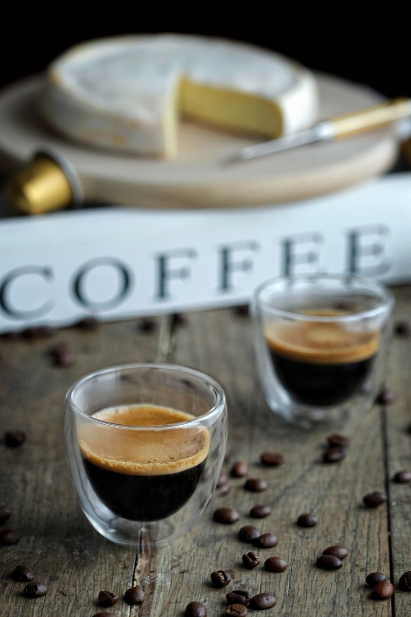 Two glasses of coffee on a rustic table