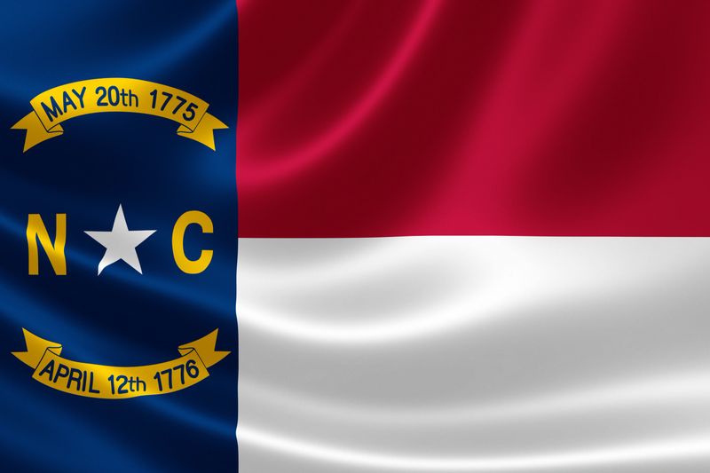 3D rendering of the flag of North Carolina on satin texture.