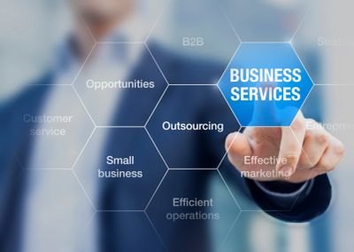 Business services concept with digital interface and businessman.