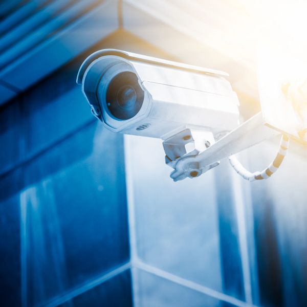 Close-up of a security camera on a building.