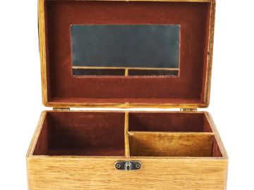 Wooden jewelry box with compartments and mirror inside.