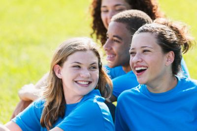 Group of happy young people smiling outdoors.