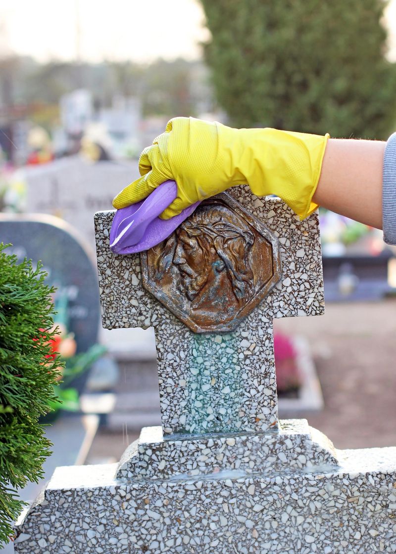 cleaning of the monument at the cemetery before All Saints Day, Poland