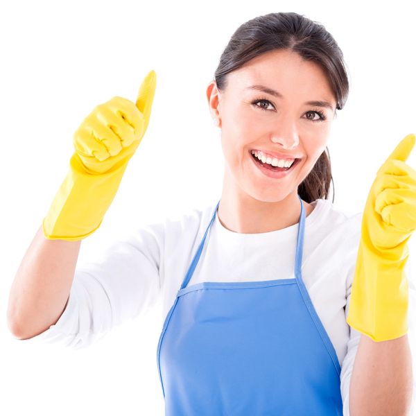 Cheerful woman in blue apron and yellow gloves ready to clean
