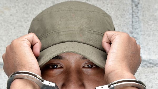 Young Man in handcuffs