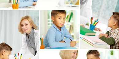 Teacher helping young students with schoolwork in a bright classroom.
