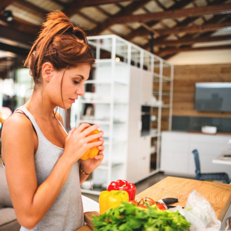 woman cooking vegan in the kitchen
