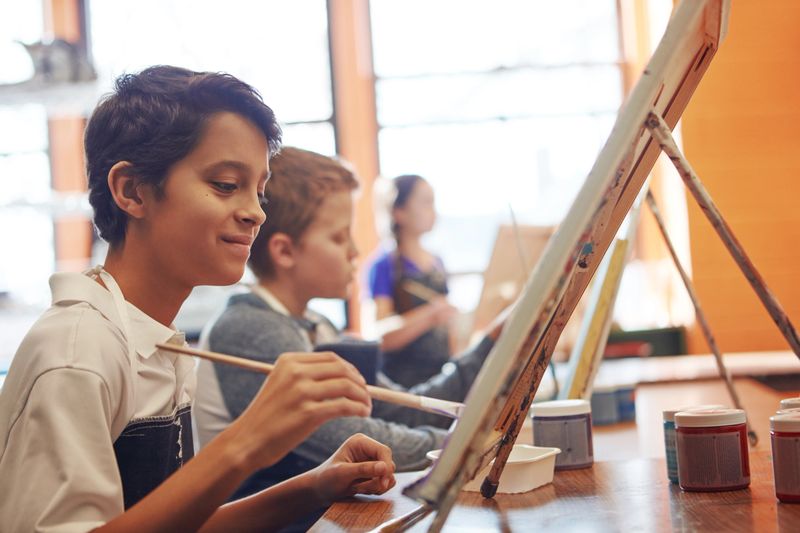 Shot of a young schoolboy in an art class