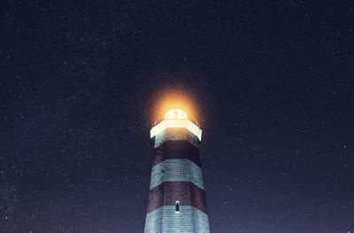 Black and white logo of Galveston Lighthouse Productions with a lighthouse and theatrical masks.