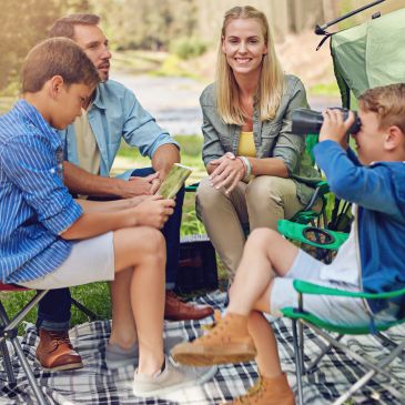 Family camping and enjoying outdoor activities.