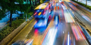 Night traffic blur on a city road.