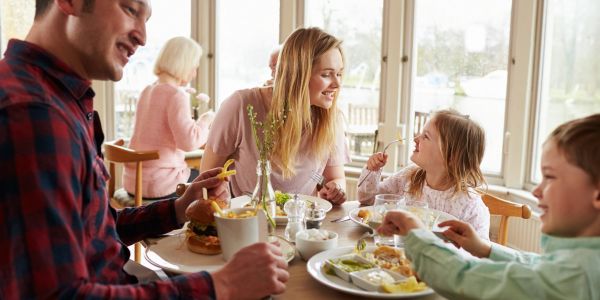 Family enjoying a meal together at a restaurant.