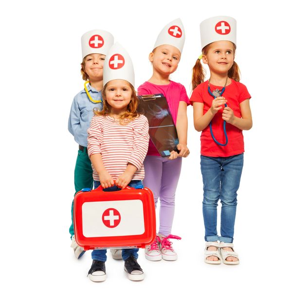 Four children dressed as doctors with medical props and nurse hats.
