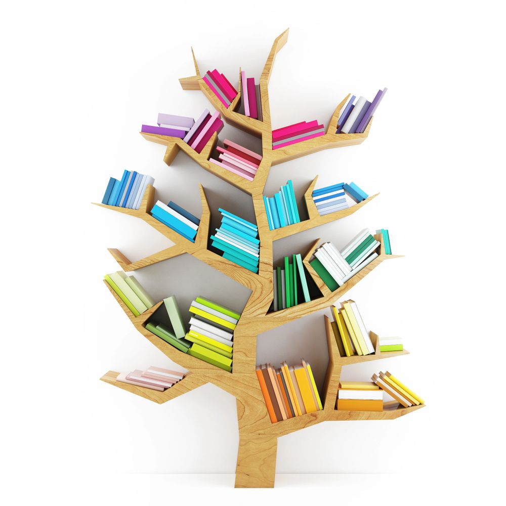 A wooden bookshelf shaped like a tree holding color-coded books.