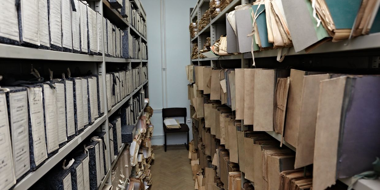 Archive room filled with old documents and files.