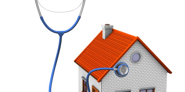 A stethoscope connected to a house, symbolizing home health care.