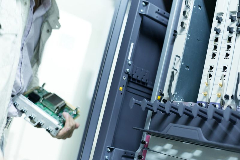 telecommunication engineer install hardware to the data server