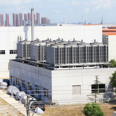 Industrial cooling units on top of a building.