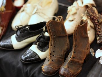 A collection of vintage shoes in various styles and colors.