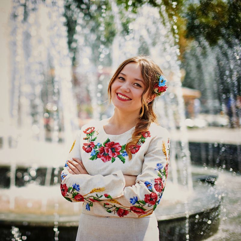 Smily girl in embroidered dress 