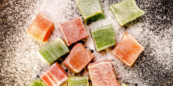 Colorful fruit-flavored gummy candies dusted with sugar.