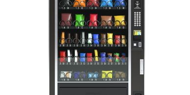 A vending machine filled with colorful snack bags and a keypad for selection.