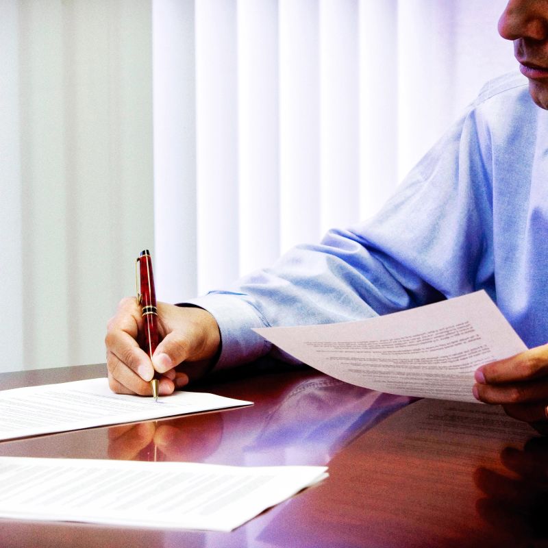Businessman signing contract.