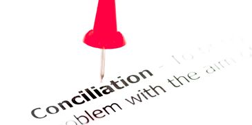 Red pushpin on the word 'Conciliation'.